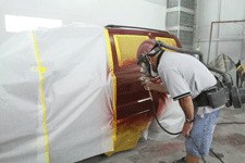 Painting a car at ABC Paint & Body Shop in Las Cruces, NM