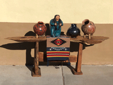 Carved wooden tables and clay pots for sale in Las Cruces
