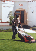 Landscaper mowing
