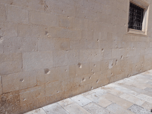 Bullet holes in wall in Dubrovnik, Croatia