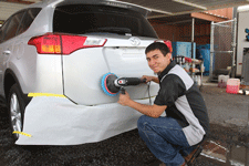 Buffing a car at ABC Paint & Body Shop in Las Cruces, NM