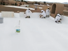 Applying Elastomeric roof coating in Las Cruces, NM