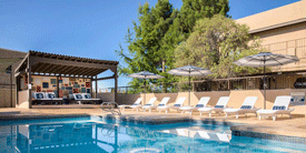 Outdoor pool with lounge beds in Las Cruces