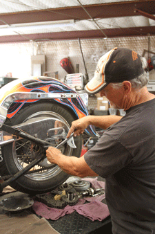 Repairing a motorcycle at Wheel Sport in Mesilla Park, NM
